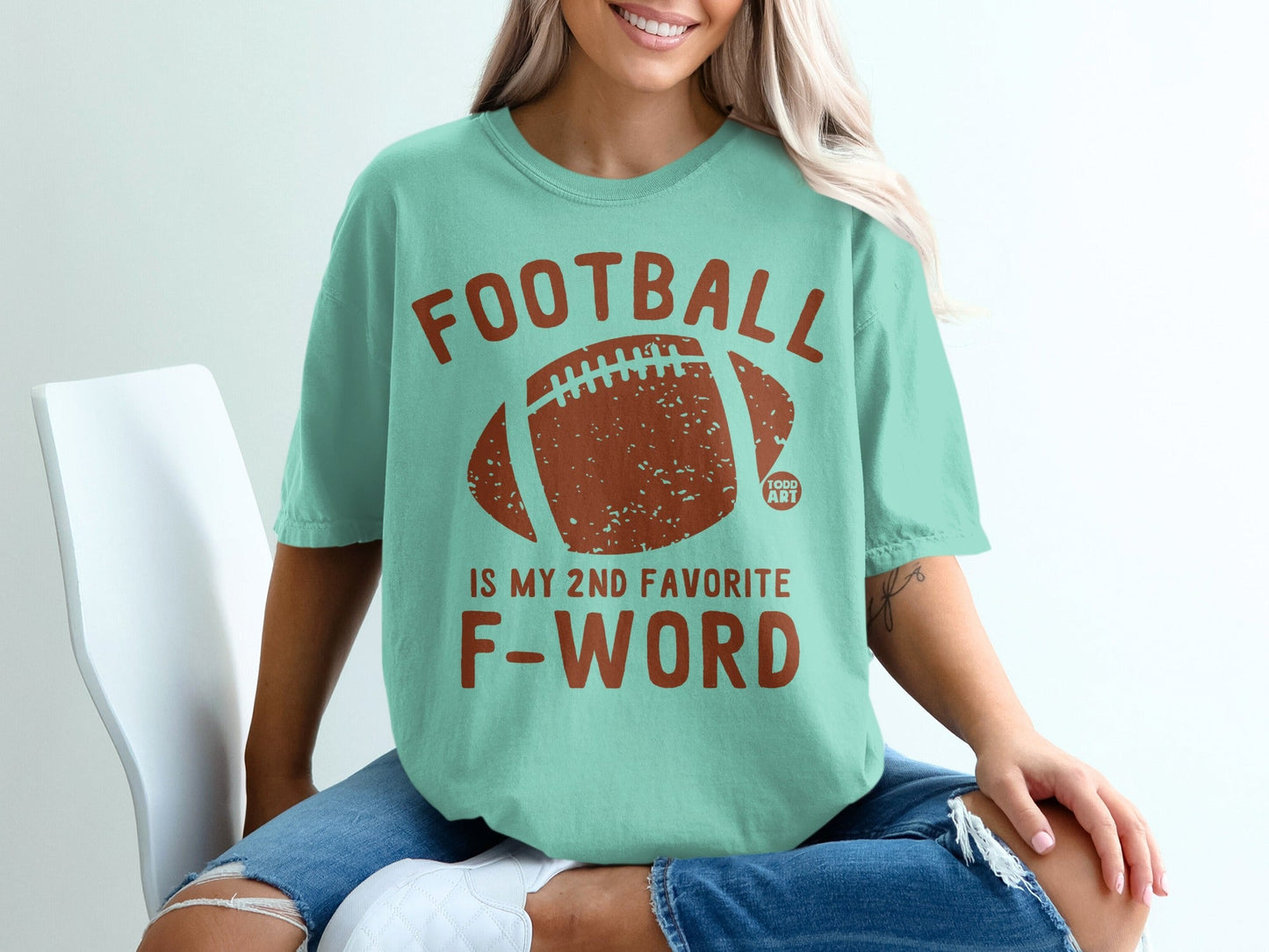 Teal t-shirt with "FOOTBALL IS MY 2ND FAVORITE F-WORD" and football graphic.