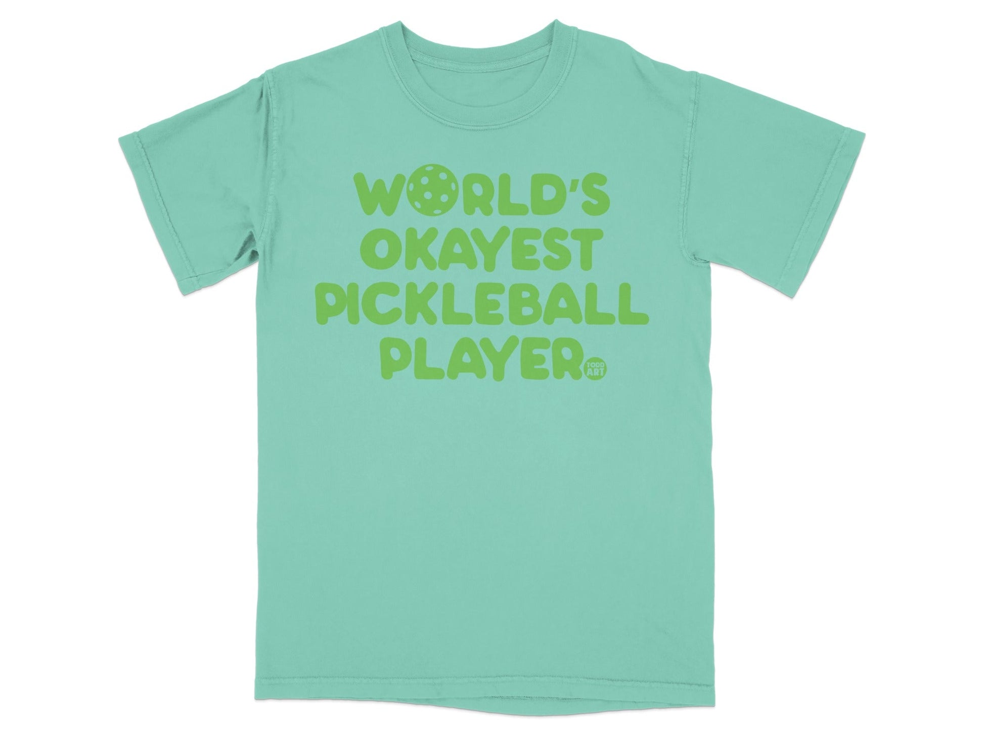 Green t-shirt with "WORLD'S OKAYEST PICKLEBALL PLAYER" text.