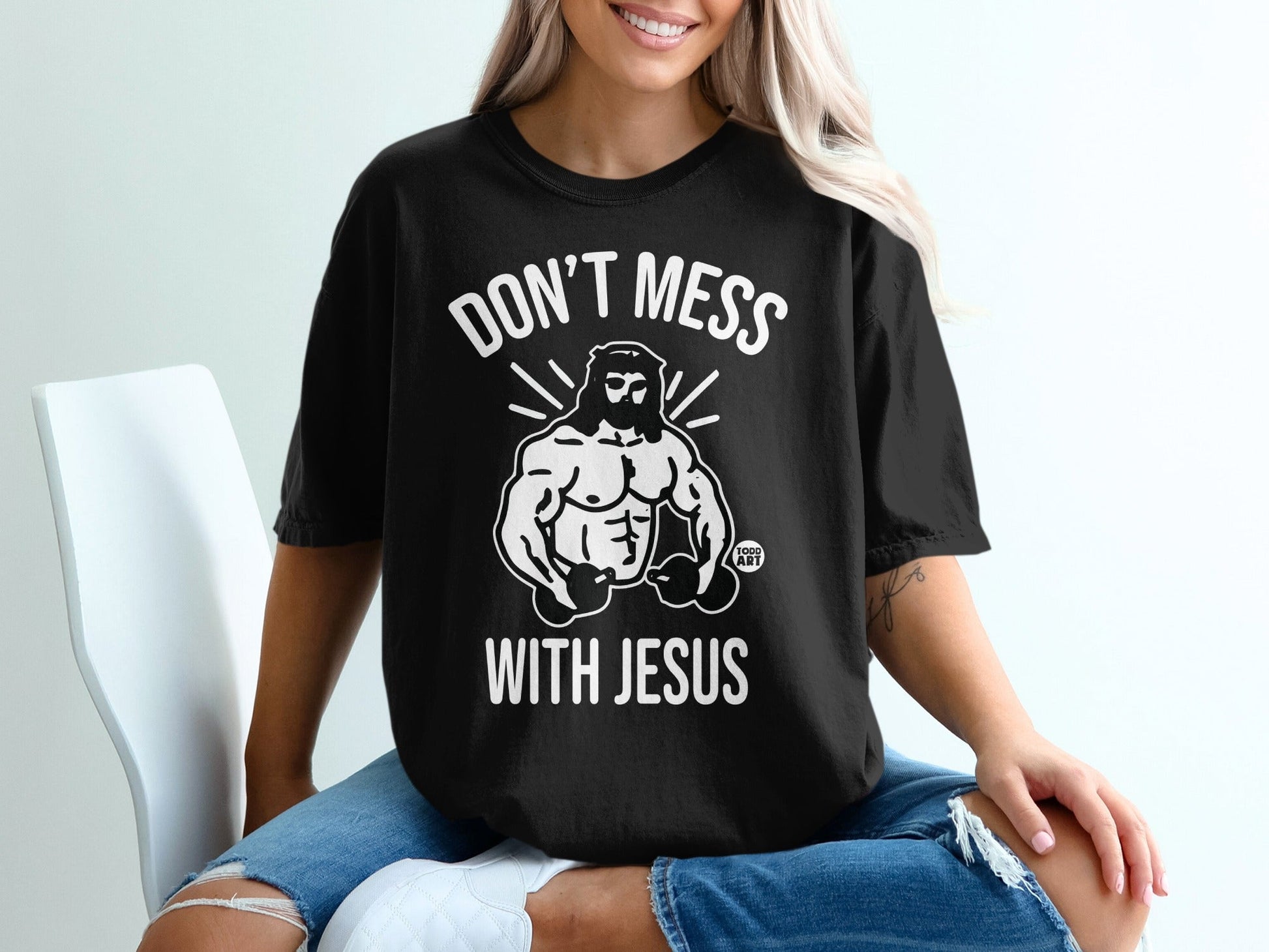 Black t-shirt with "DON'T MESS WITH JESUS" and muscular Jesus graphic.