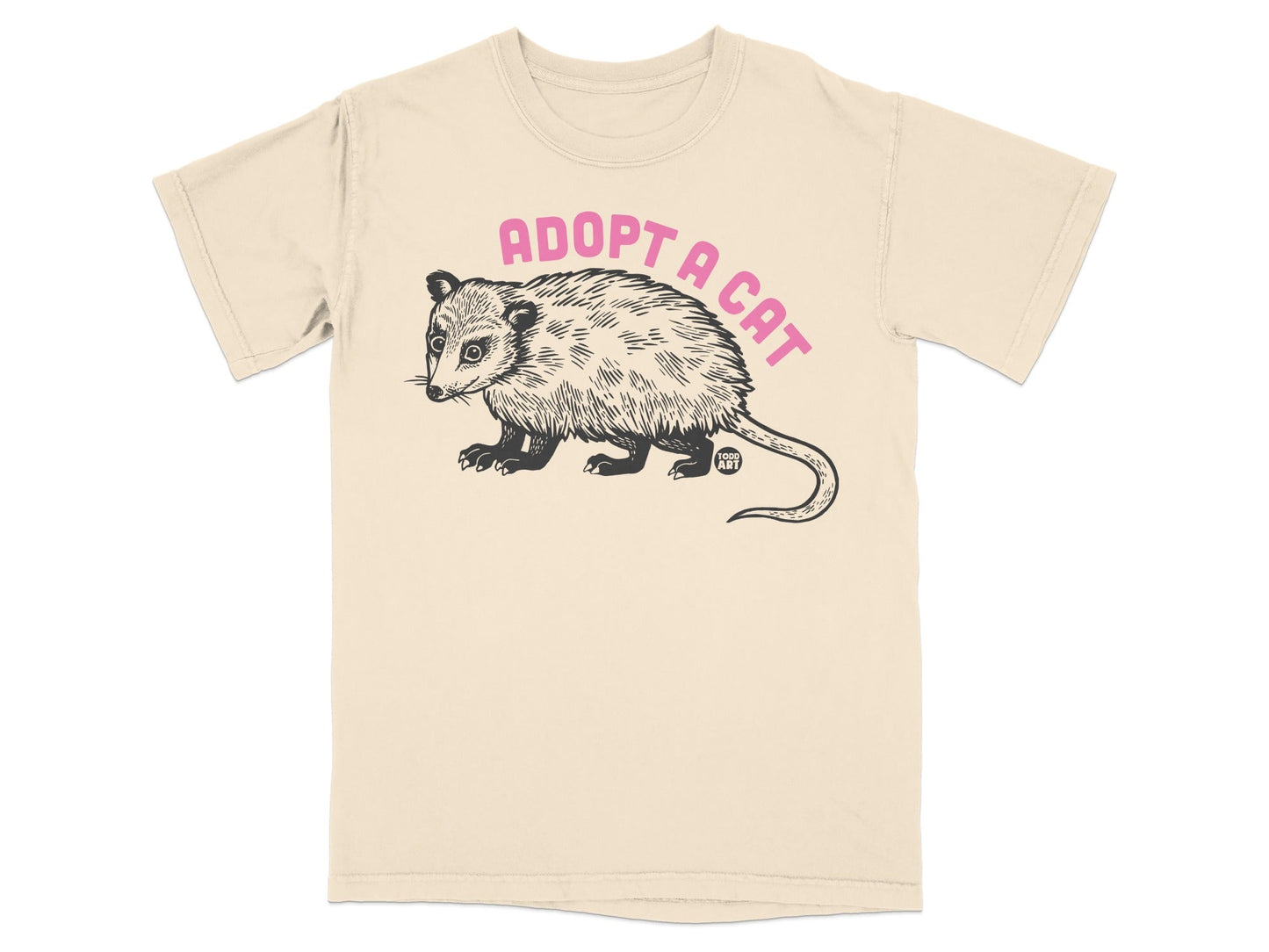 Cream t-shirt with black opossum and text "ADOPT A CAT".
