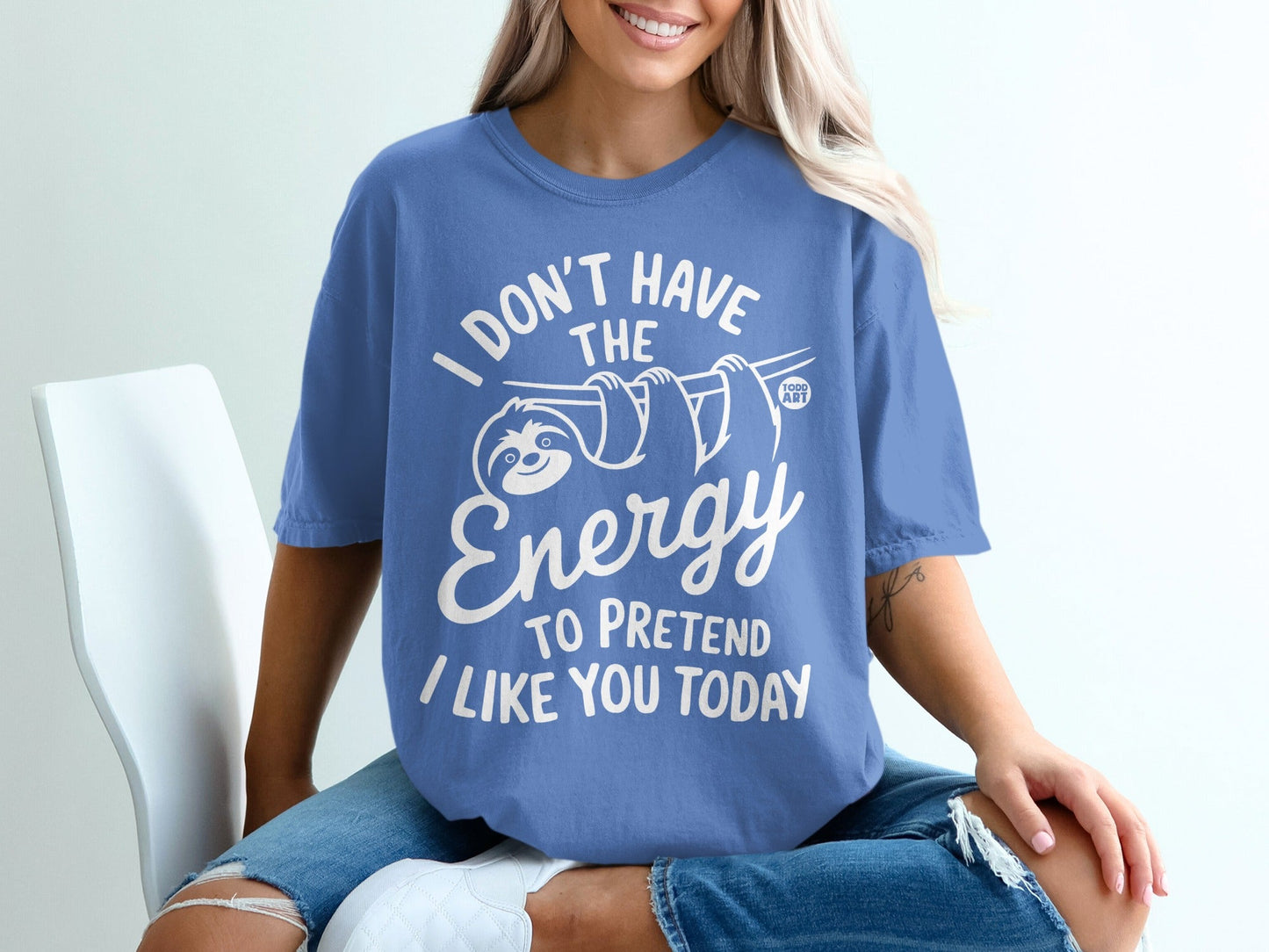 Blue t-shirt with sloth graphic and text "I DON'T HAVE THE ENERGY TO PRETEND I LIKE YOU TODAY".