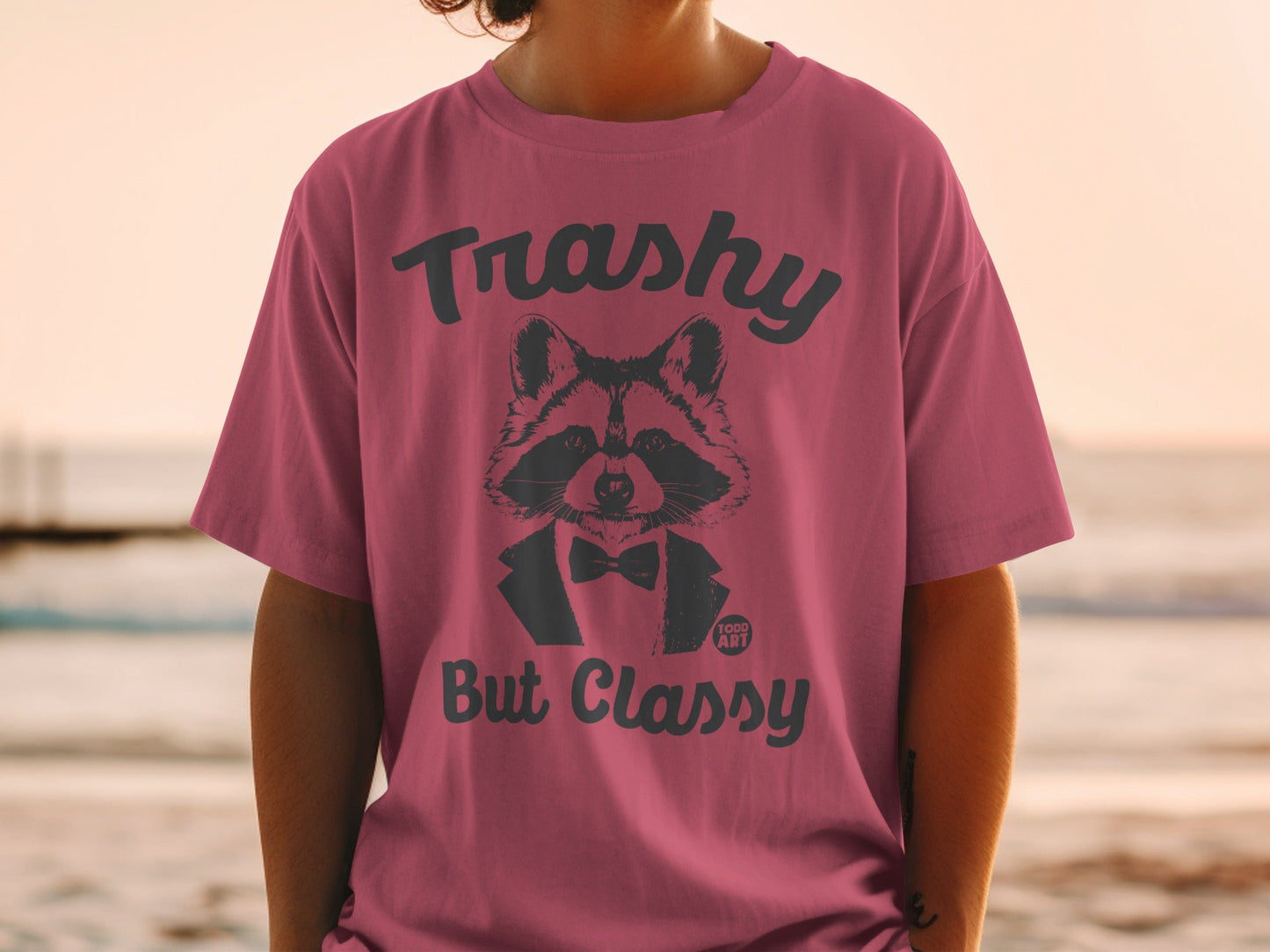 T-shirt with raccoon wearing a bow tie and the text "Trashy But Classy"