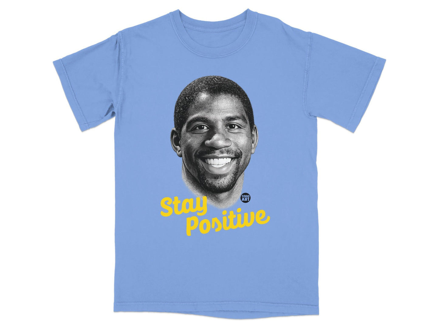 Light blue t-shirt with Magic Johnson portrait and "Stay Positive" text.
