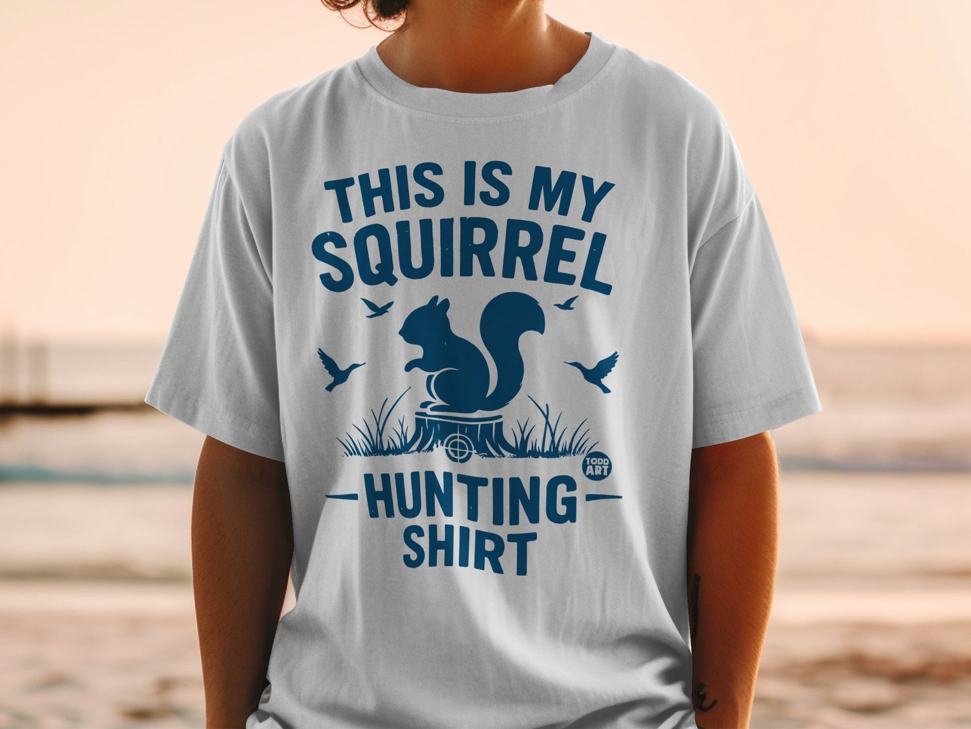 White t-shirt with blue text: "This is my squirrel hunting shirt."