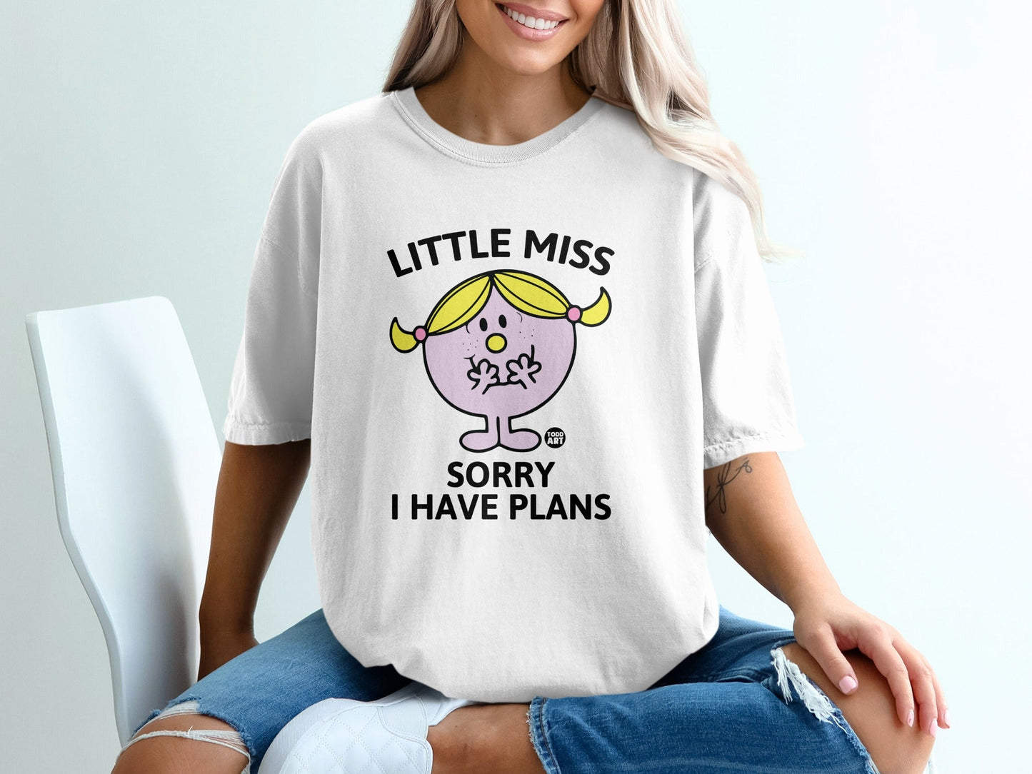 White t-shirt with "Little Miss Sorry I Have Plans" graphic on a woman.