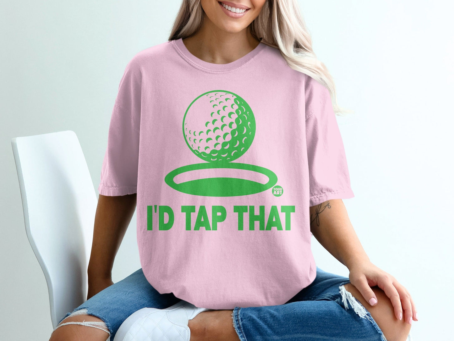 Pink t-shirt with "I'd Tap That" and a golf ball design.