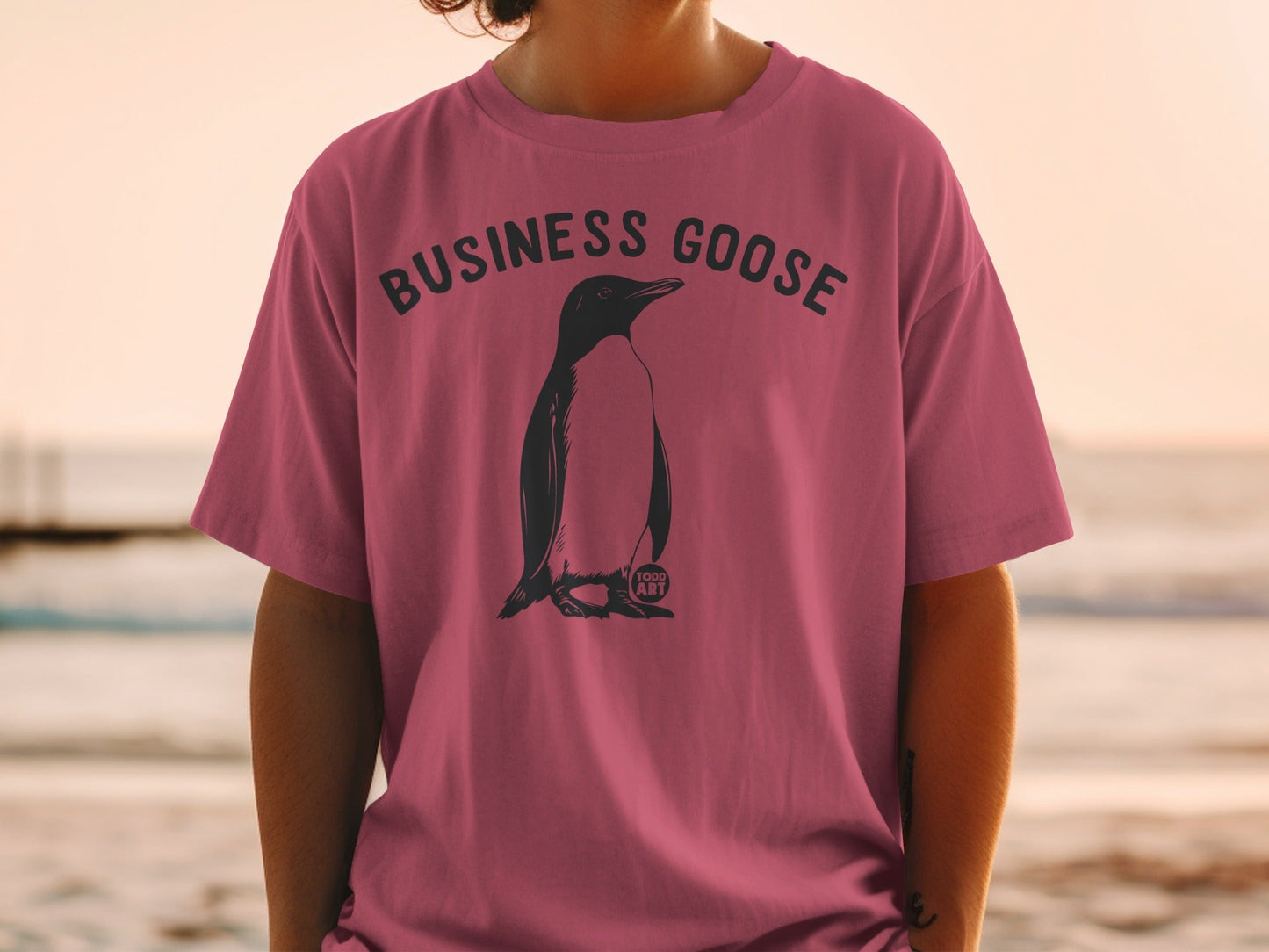 T-shirt with "BUSINESS GOOSE" text and penguin graphic.