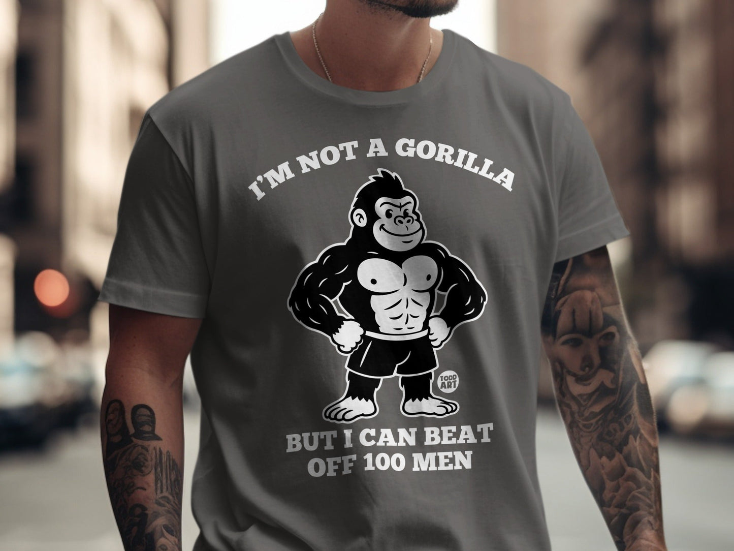Gray t-shirt with gorilla graphic and text "I'm not a gorilla but I can beat off 100 men".