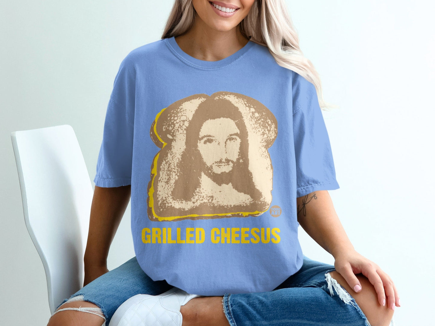 Blue t-shirt with "GRILLED CHEESUS" text and Jesus on toast graphic.