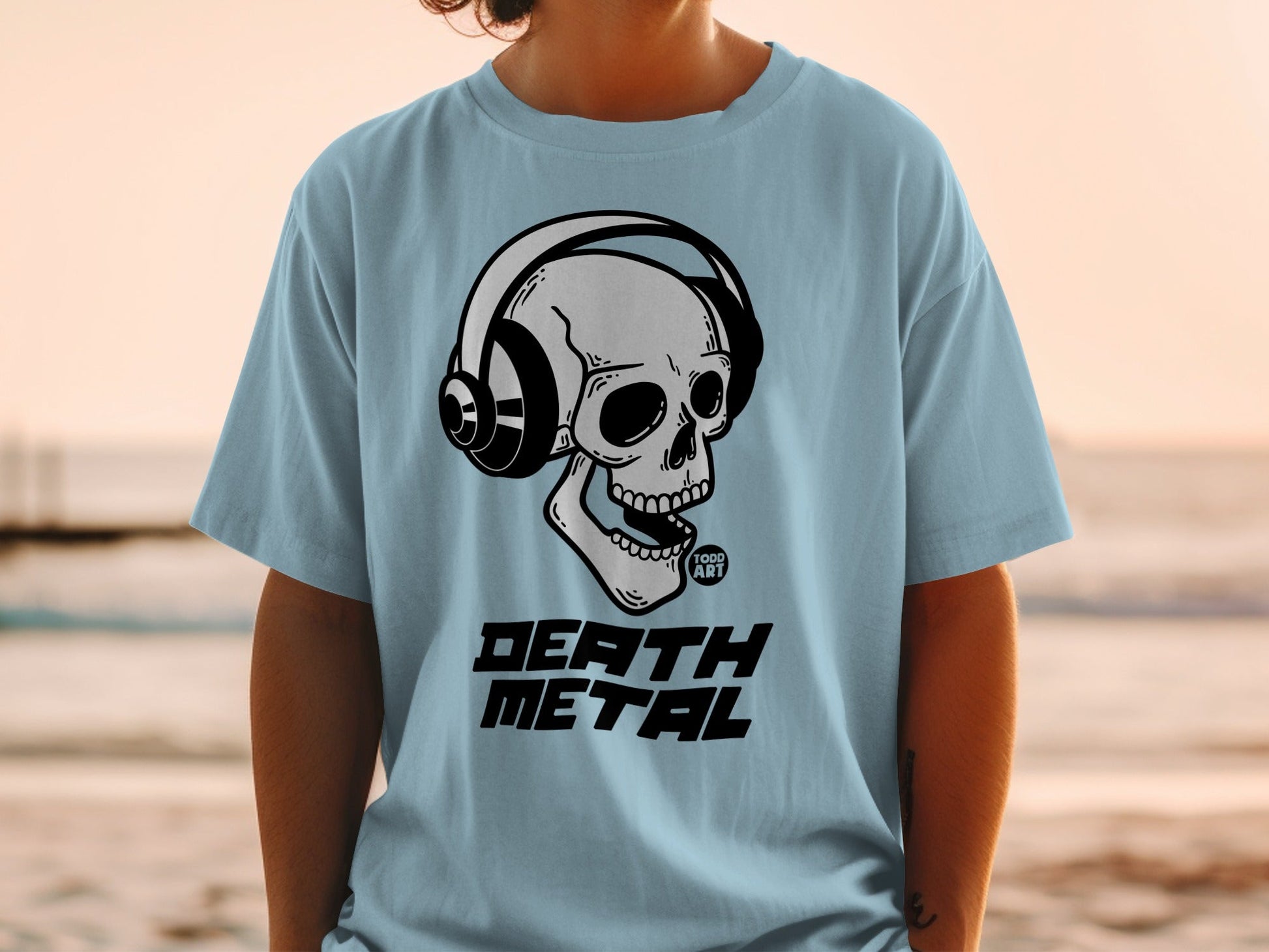 Light blue t-shirt with skull wearing headphones and "DEATH METAL" text.