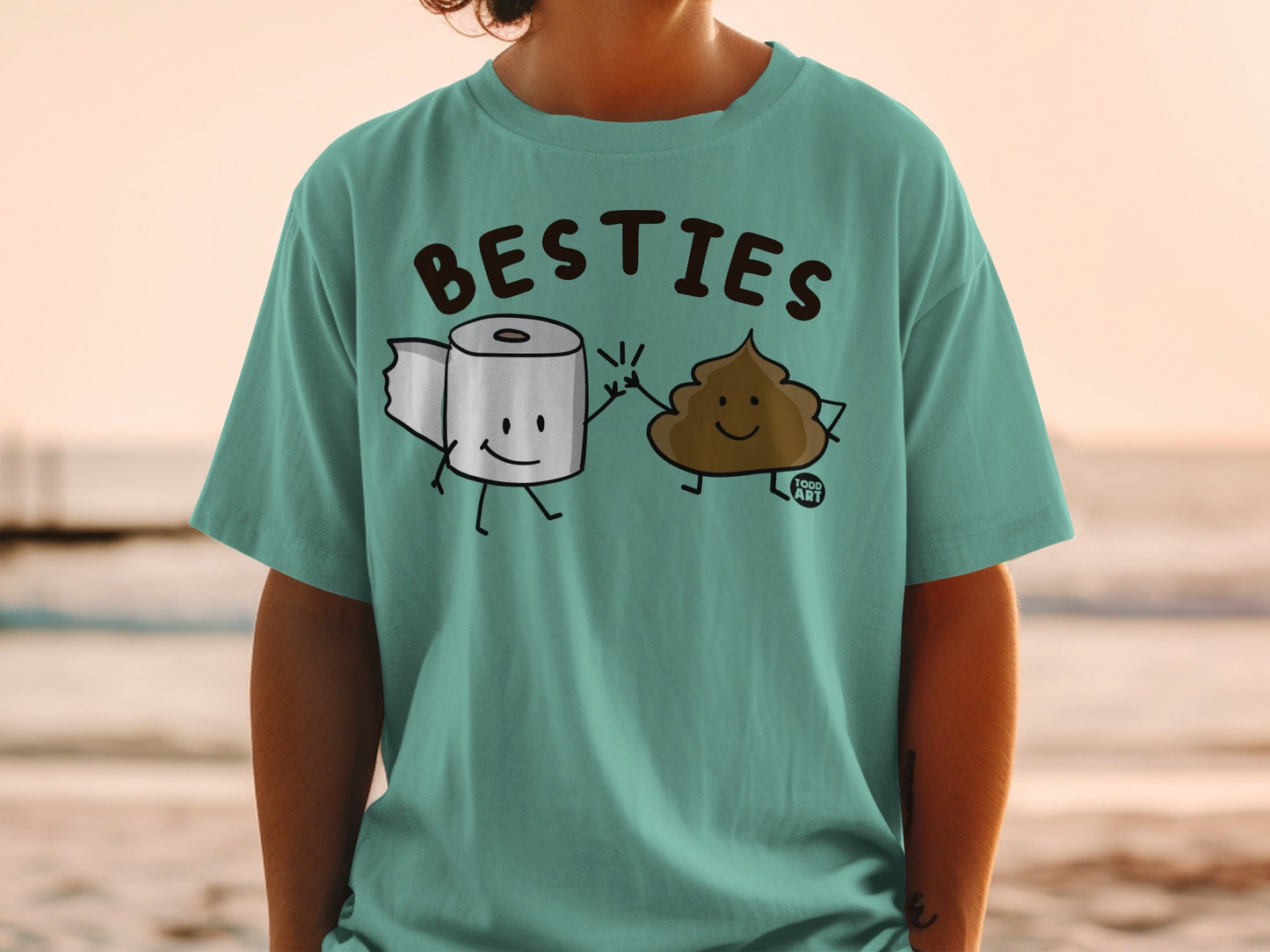 T-shirt with cartoon toilet paper and smiling poop characters holding hands.