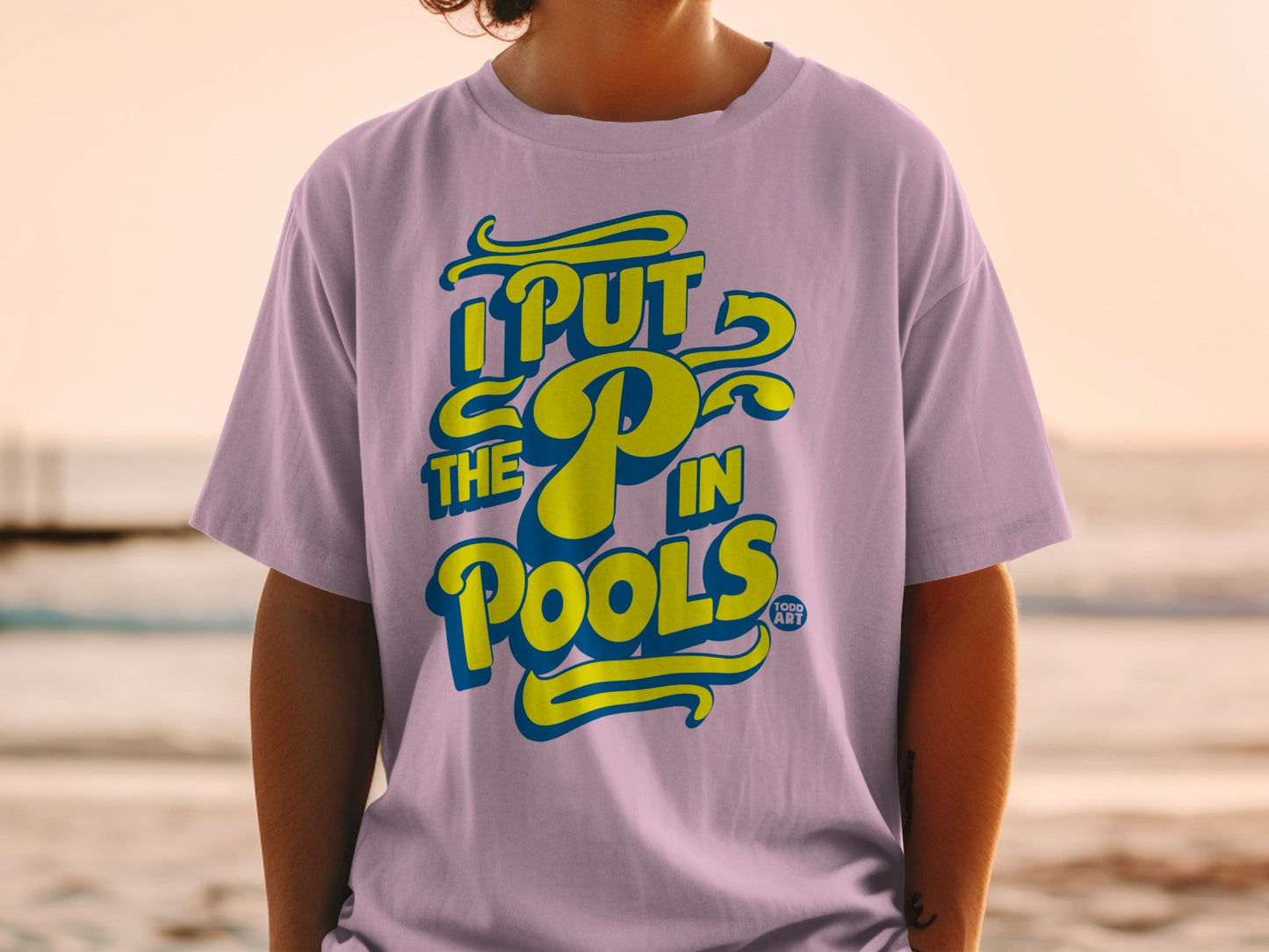 Purple t-shirt with yellow text "I PUT THE P IN POOLS".