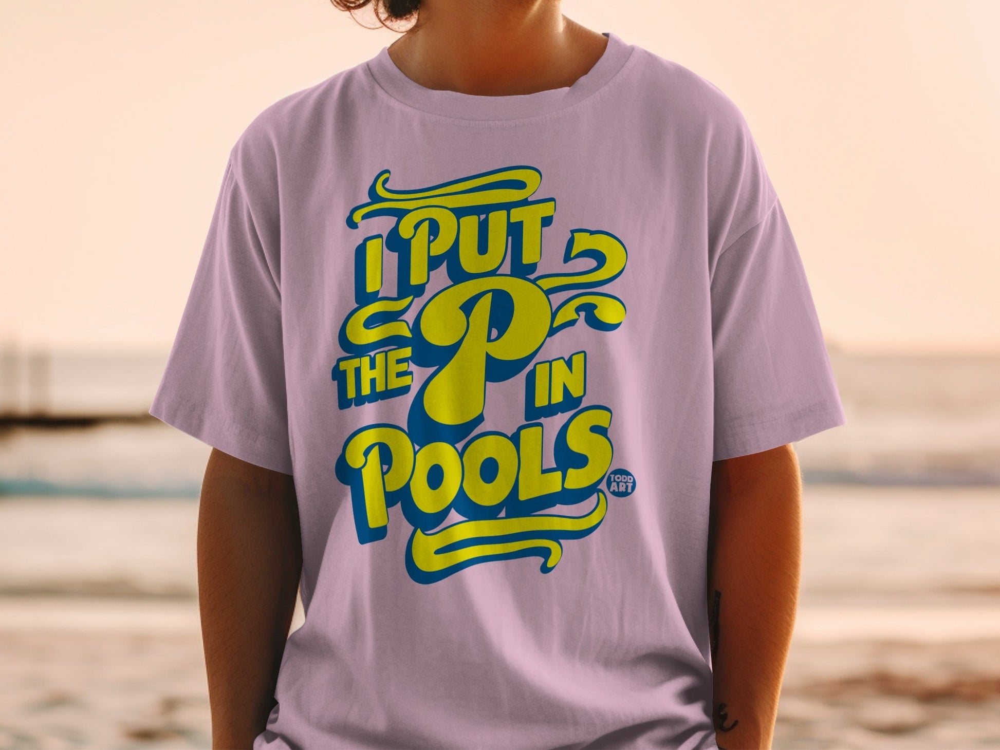 Purple t-shirt with yellow text "I PUT THE P IN POOLS".