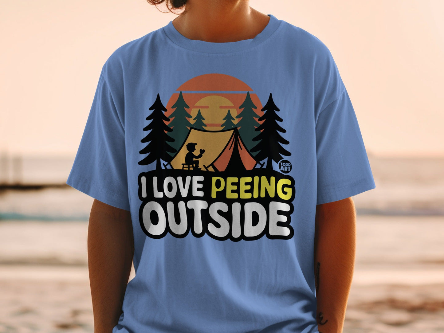 Light blue t-shirt with "I Love Peeing Outside" text and camping graphic.