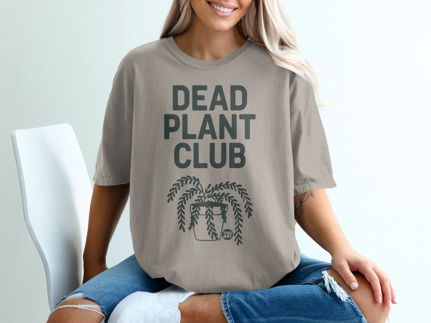 T-shirt with "DEAD PLANT CLUB" text and a potted plant graphic.