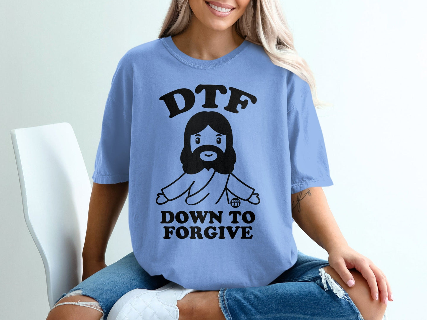 Light blue t-shirt with "DTF DOWN TO FORGIVE" and Jesus graphic.