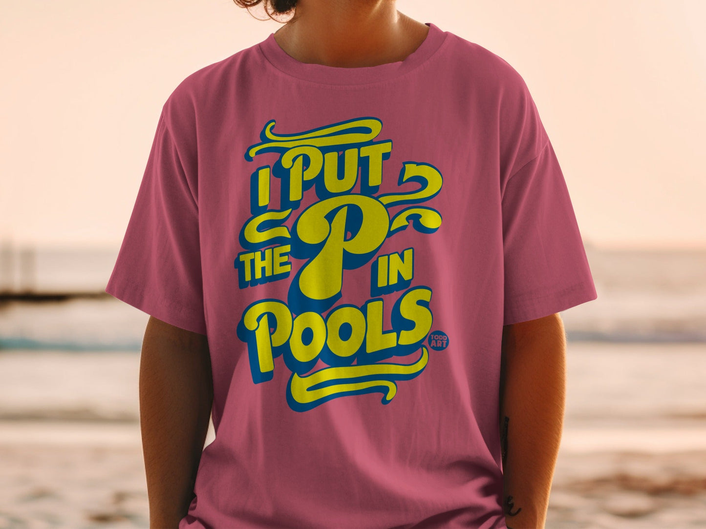 Pink t-shirt with yellow text: "I PUT THE P in POOLS".