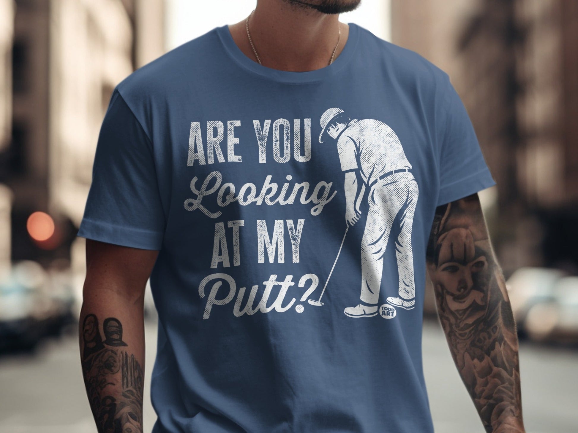 Blue t-shirt with golfer graphic and text "ARE YOU Looking AT MY Putt?"