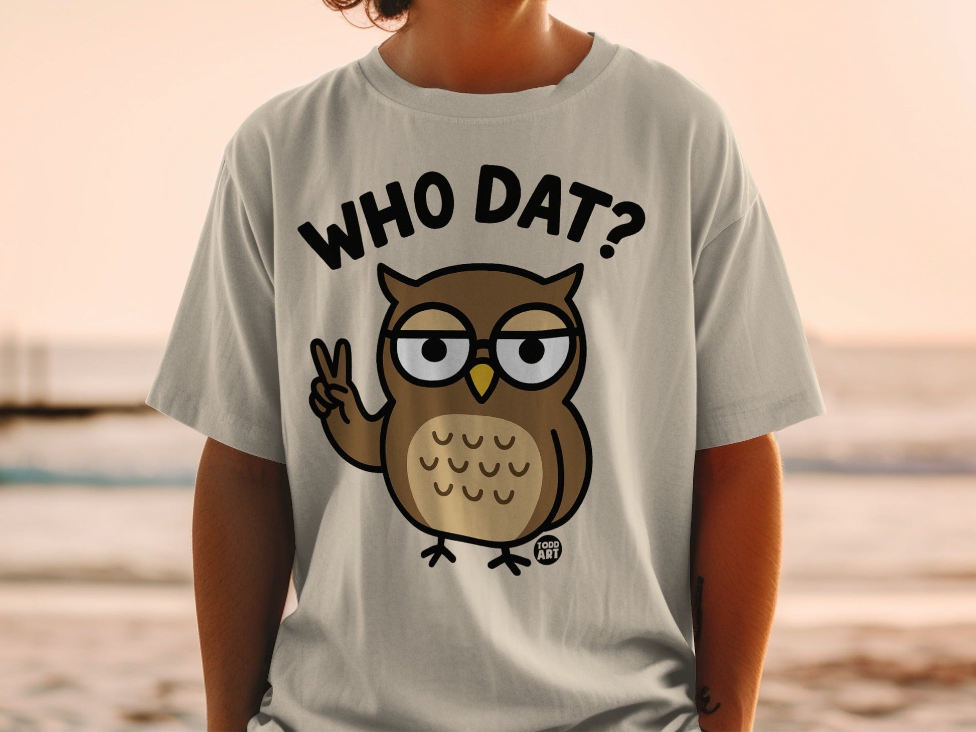 Cartoon owl wearing glasses and holding up two fingers, text says "WHO DAT?"