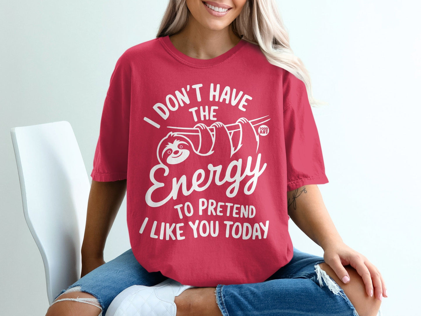 Red t-shirt with white text: "I don't have the energy to pretend I like you today."
