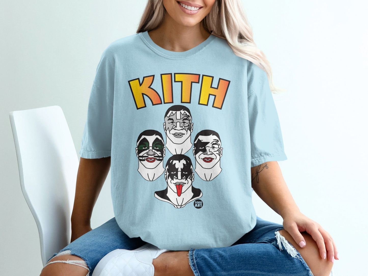 Light blue t-shirt with Kith logo and four KISS band member faces.