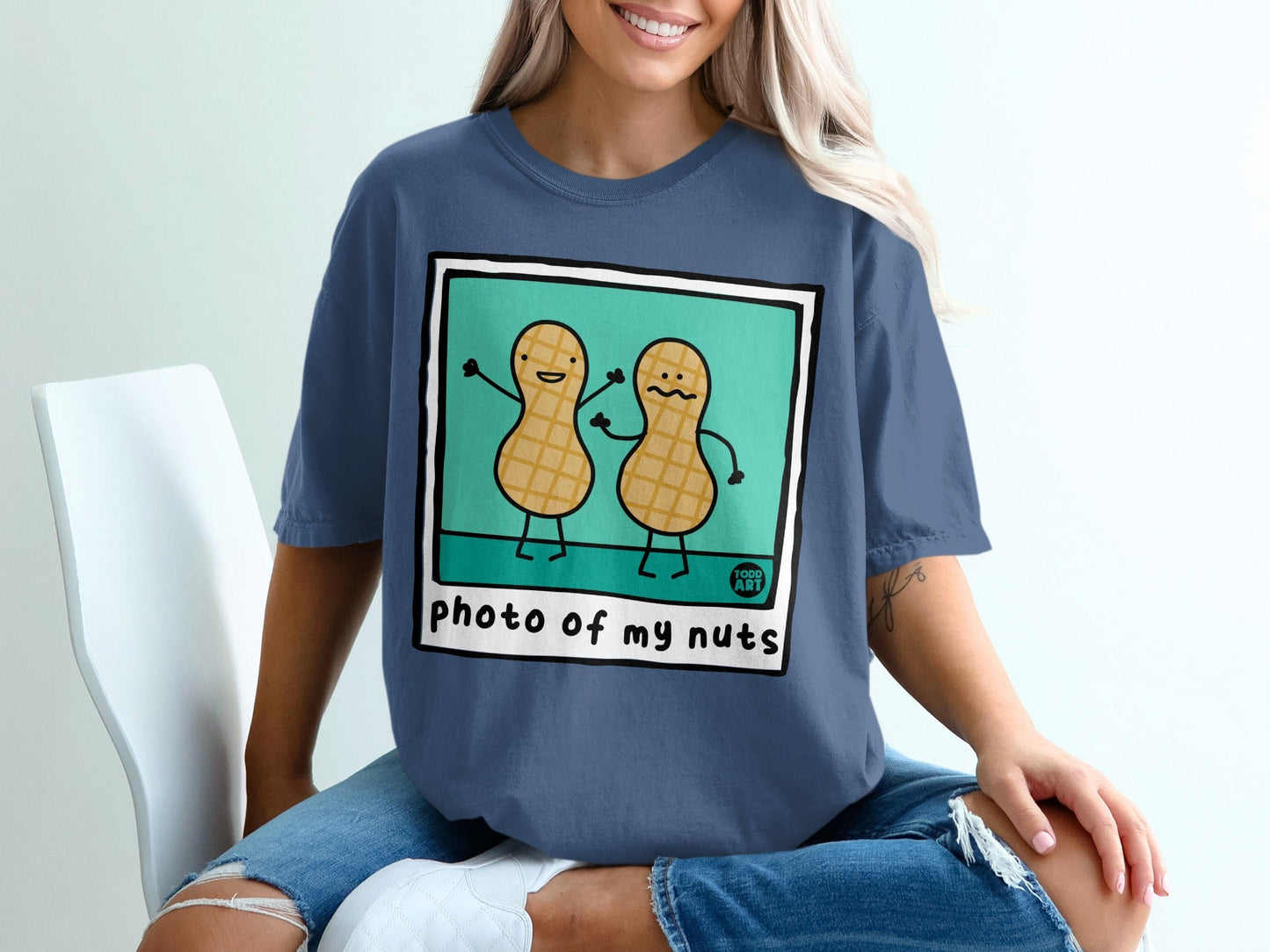 T-shirt with cartoon peanuts on front and "photo of my nuts" text.