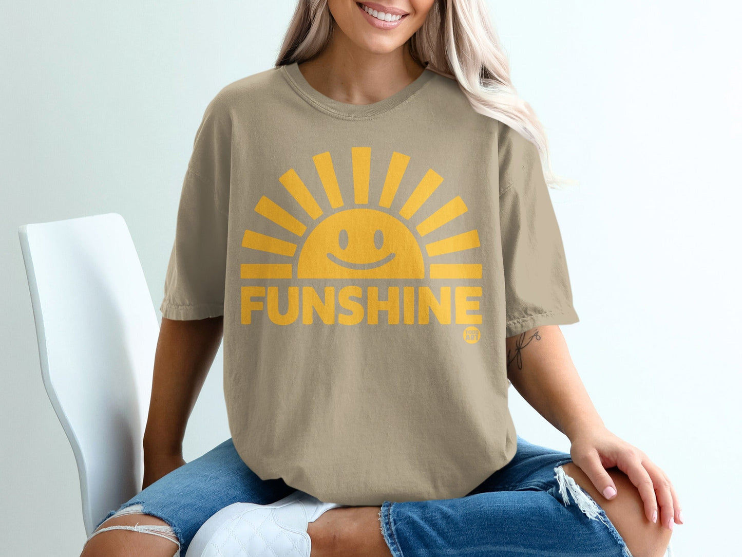 Tan t-shirt with a smiling sun graphic and "FUNSHINE" text.