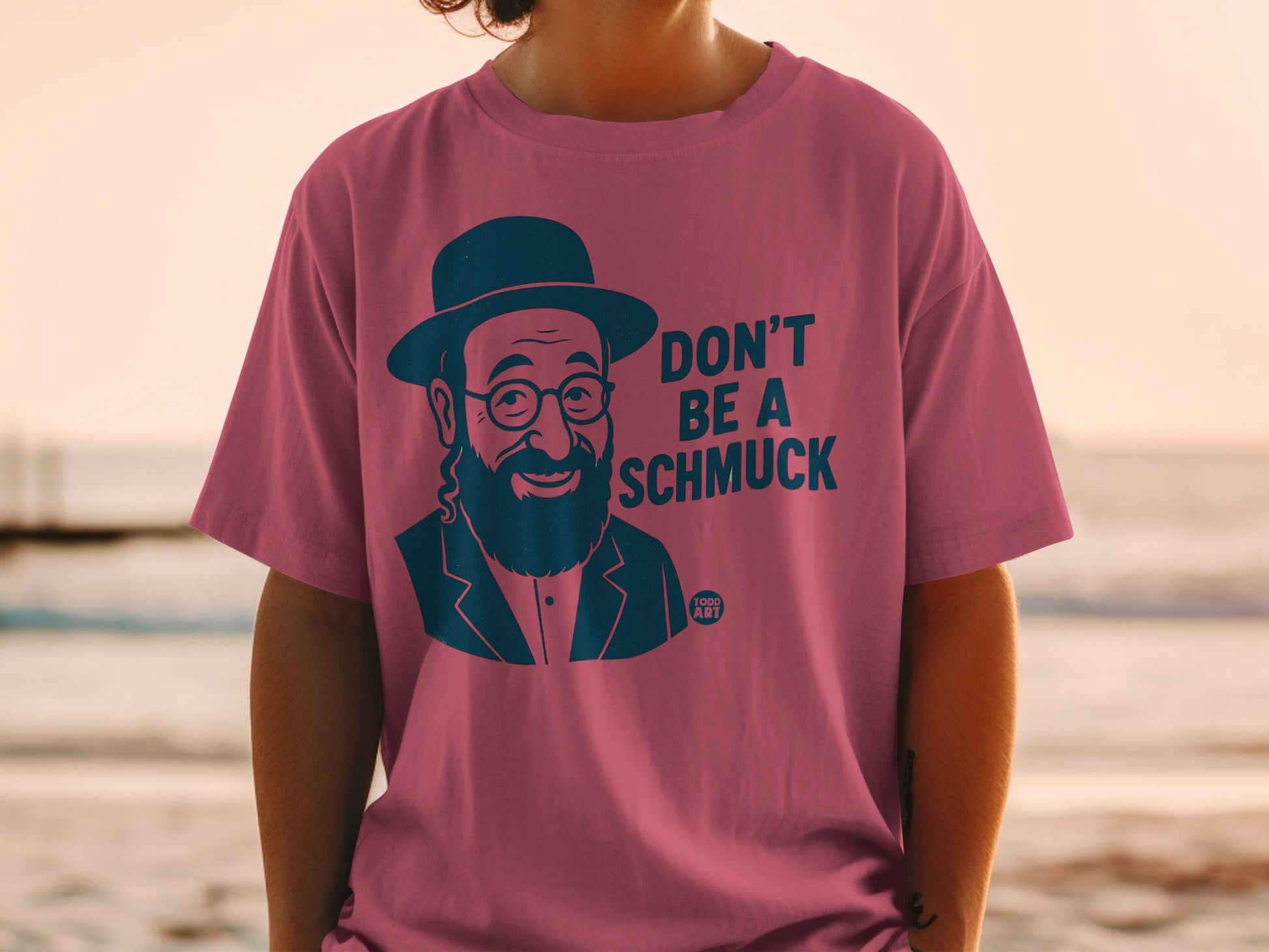 Pink t-shirt with "Don't be a Schmuck" and "Food Art" text.
