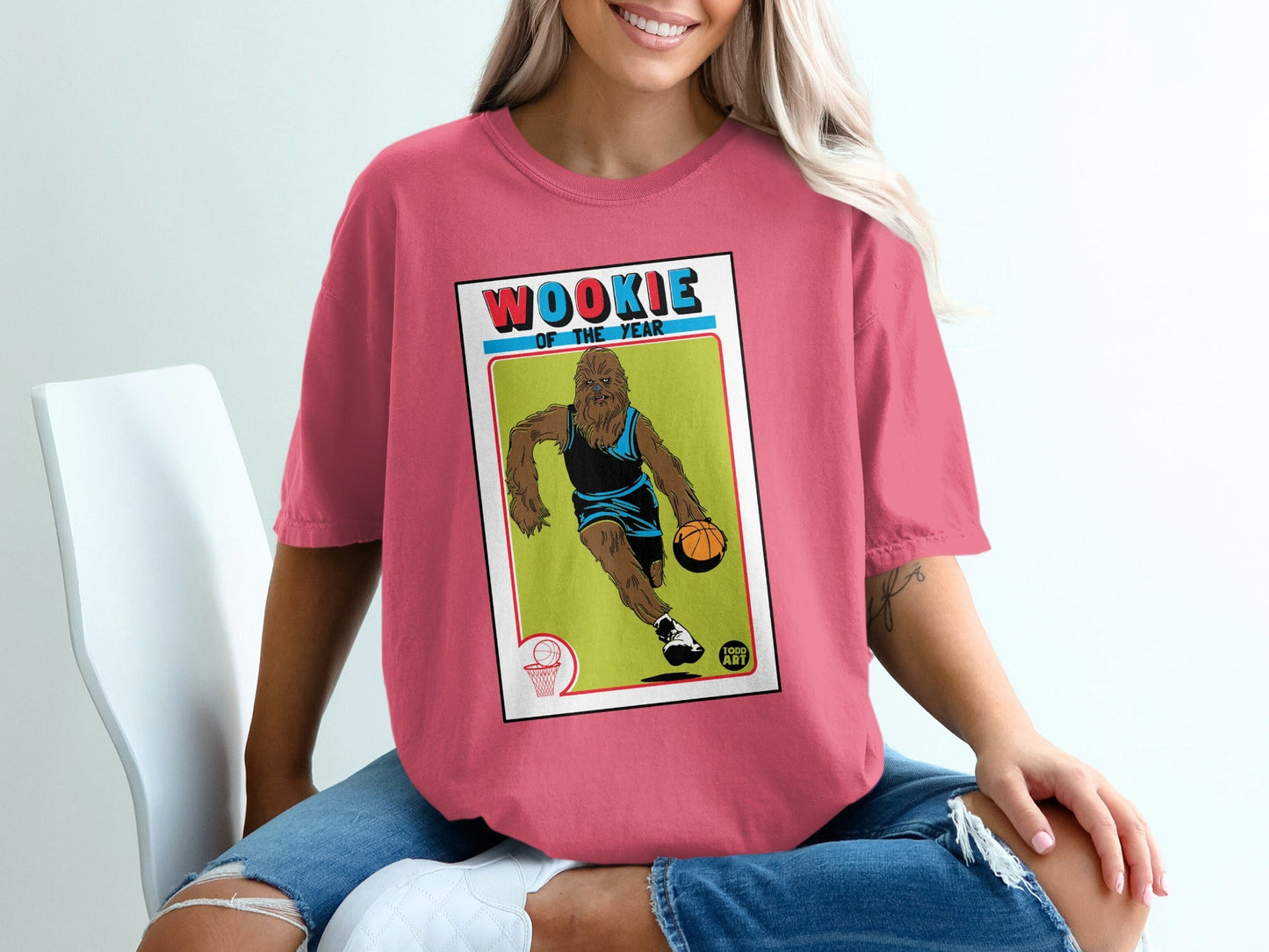 Wookiee of the Year graphic on pink t-shirt with basketball player.