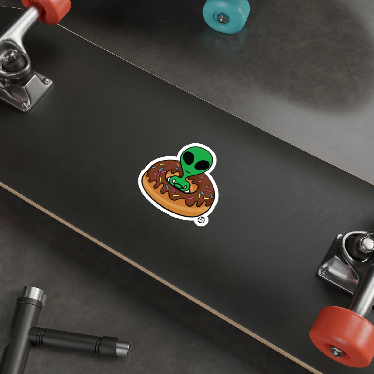 Alien in Donut with Sprinkles Sticker for Your Gear