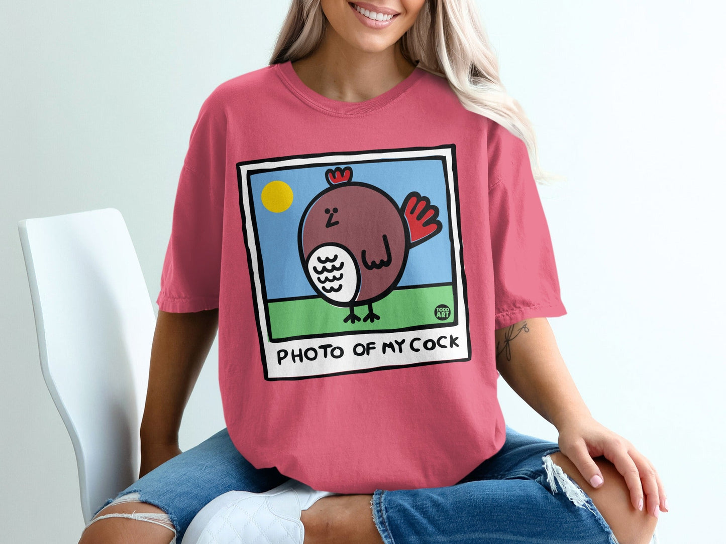 T-shirt with illustration of a brown bird and text "PHOTO OF MY COCK".