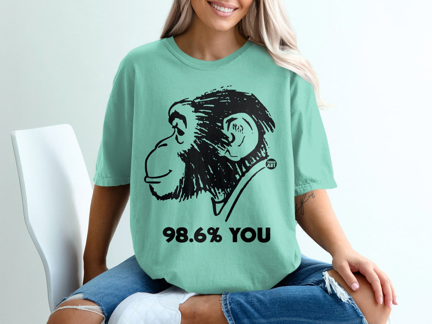 Mint t-shirt with black monkey graphic and "98.6% YOU" text.
