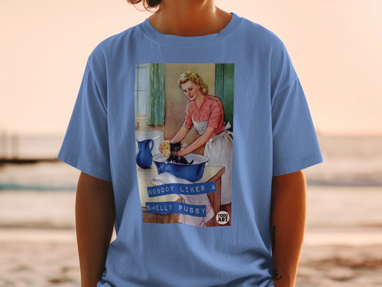 Retro illustration of a woman washing a cat with text "NOBODY LIKES A SMELLY PUSSY".