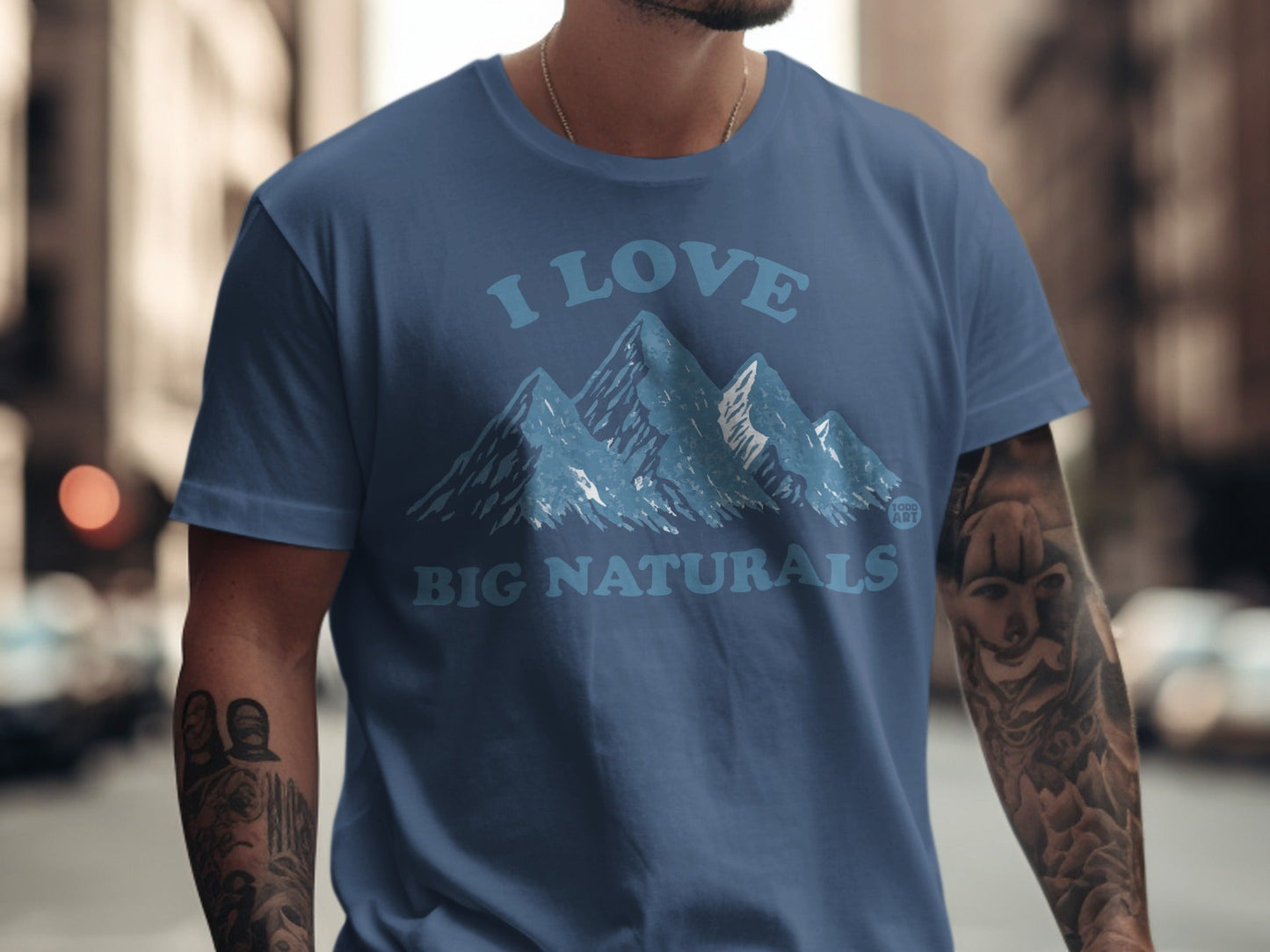 Blue t-shirt with "I LOVE BIG NATURALS" and mountain graphic.