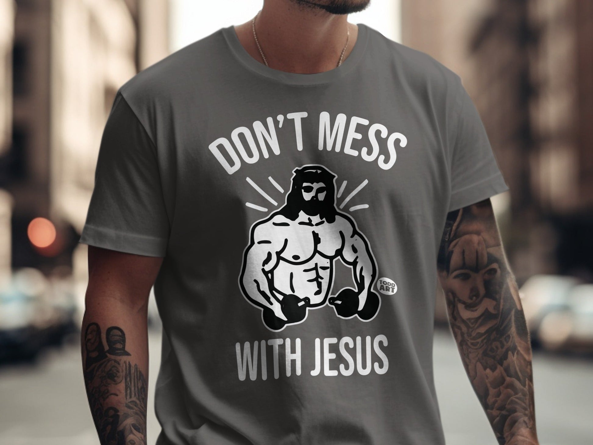 Gray t-shirt with muscular Jesus graphic and "Don't Mess With Jesus" text.