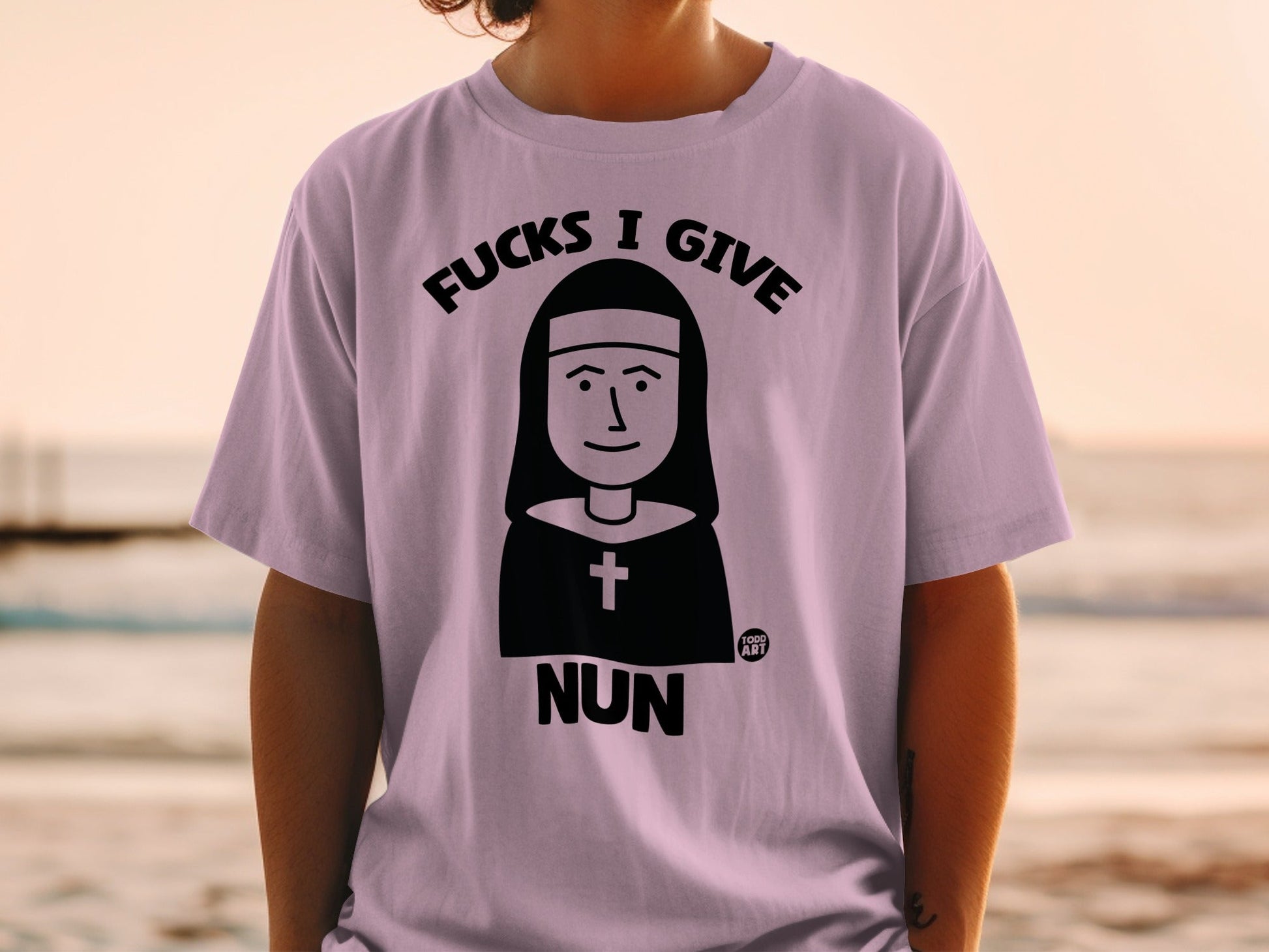 T-shirt with black nun illustration and text, "Fucks I Give Nun."