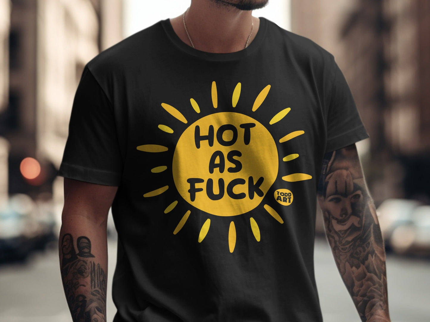 Black t-shirt with yellow sun graphic and "HOT AS FUCK" text.