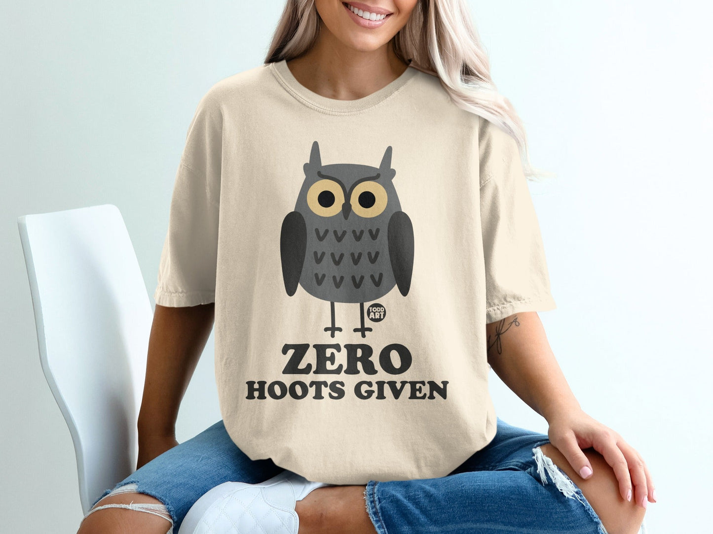 T-shirt with owl graphic and text "ZERO HOOTS GIVEN".