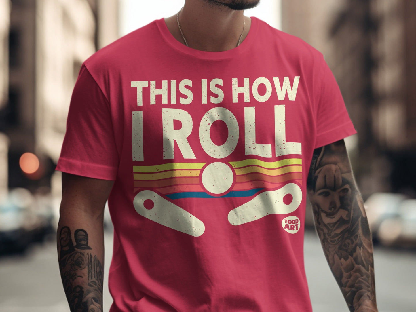 Pink t-shirt with "THIS IS HOW I ROLL" and pinball graphic.