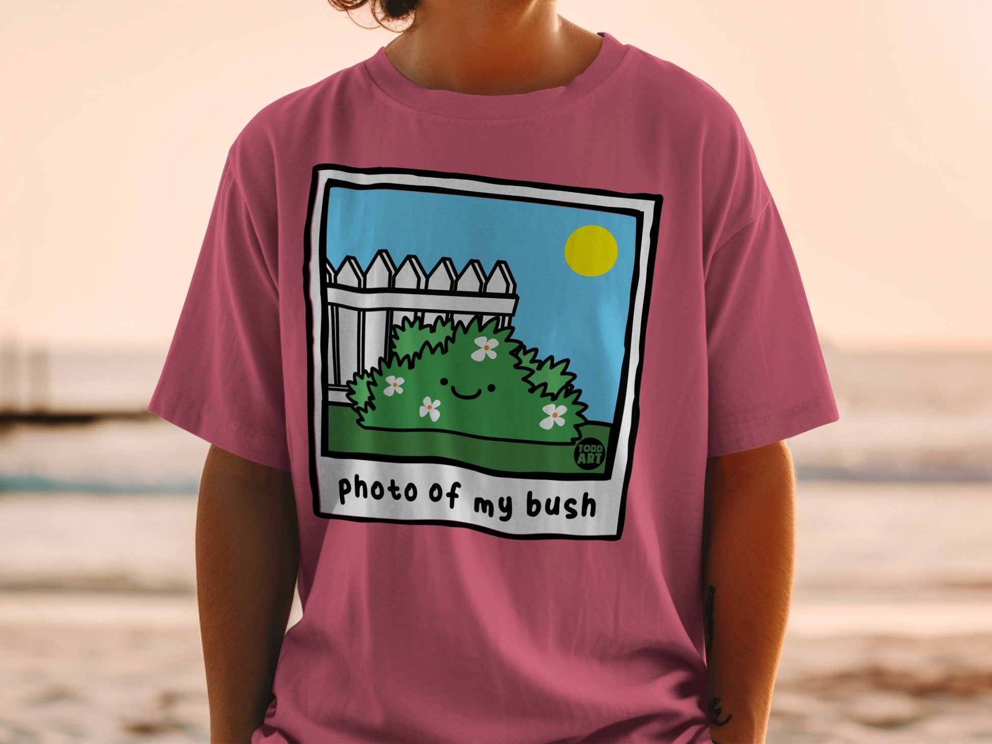 T-shirt graphic with cartoon bush and text "photo of my bush".