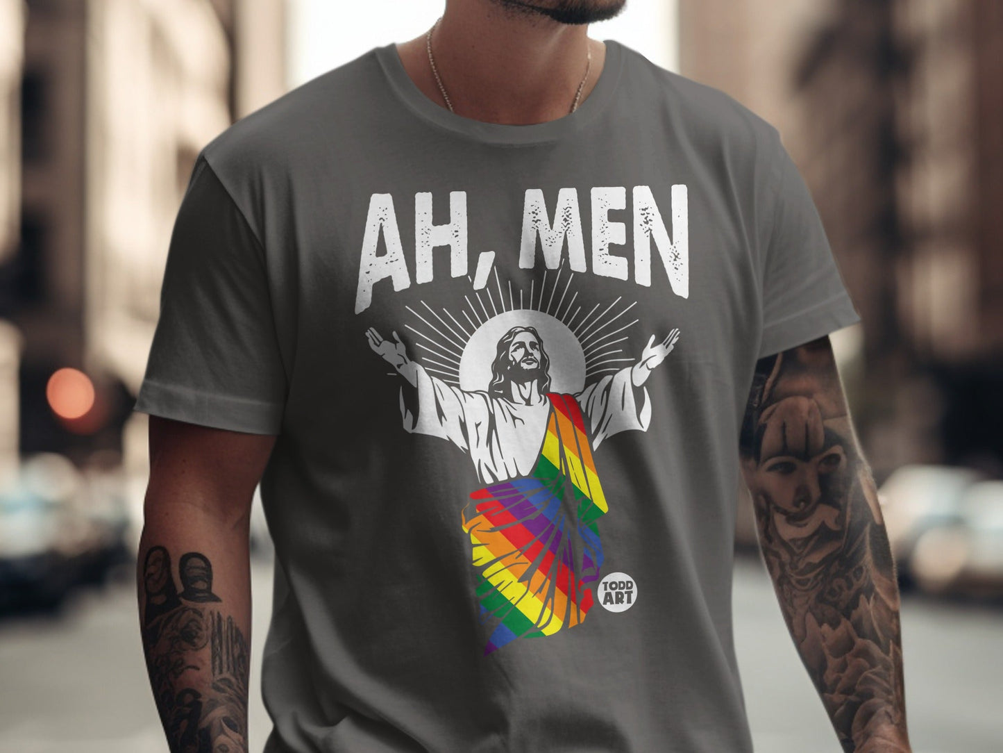 Gray t-shirt with Jesus figure in rainbow flag, "AH, MEN" text.