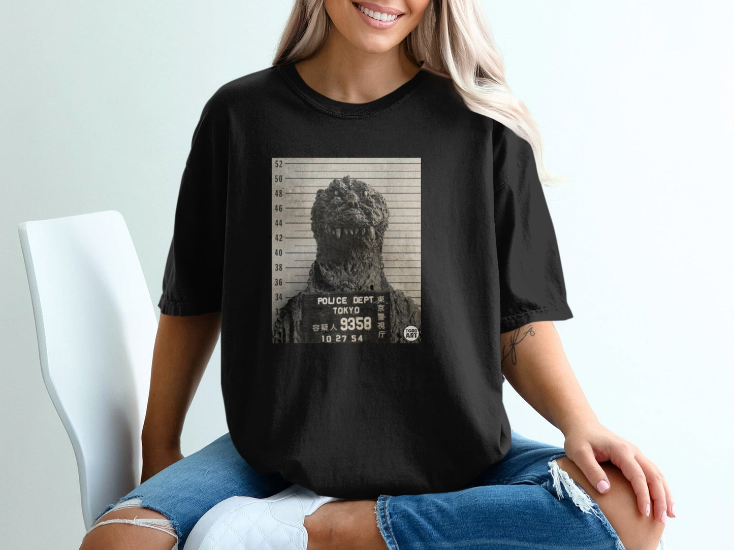Black t-shirt with Godzilla mugshot featuring "TOKYO POLICE DEPT" text.