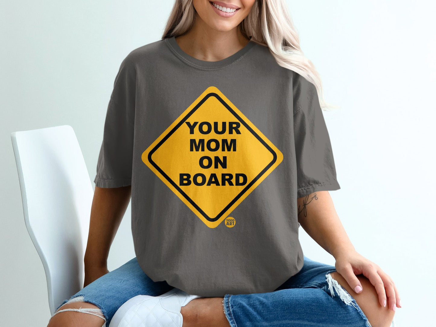 Dark grey t-shirt with yellow diamond "Your Mom On Board" graphic.