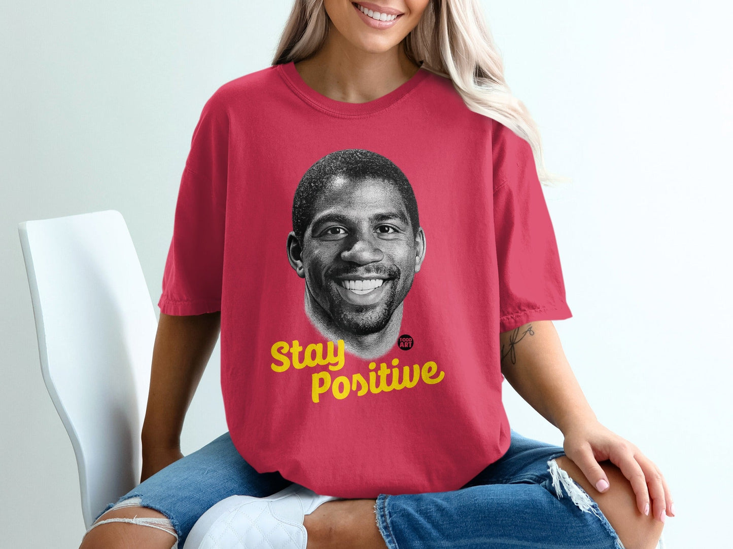 Red t-shirt with Magic Johnson's face and "Stay Positive" text.