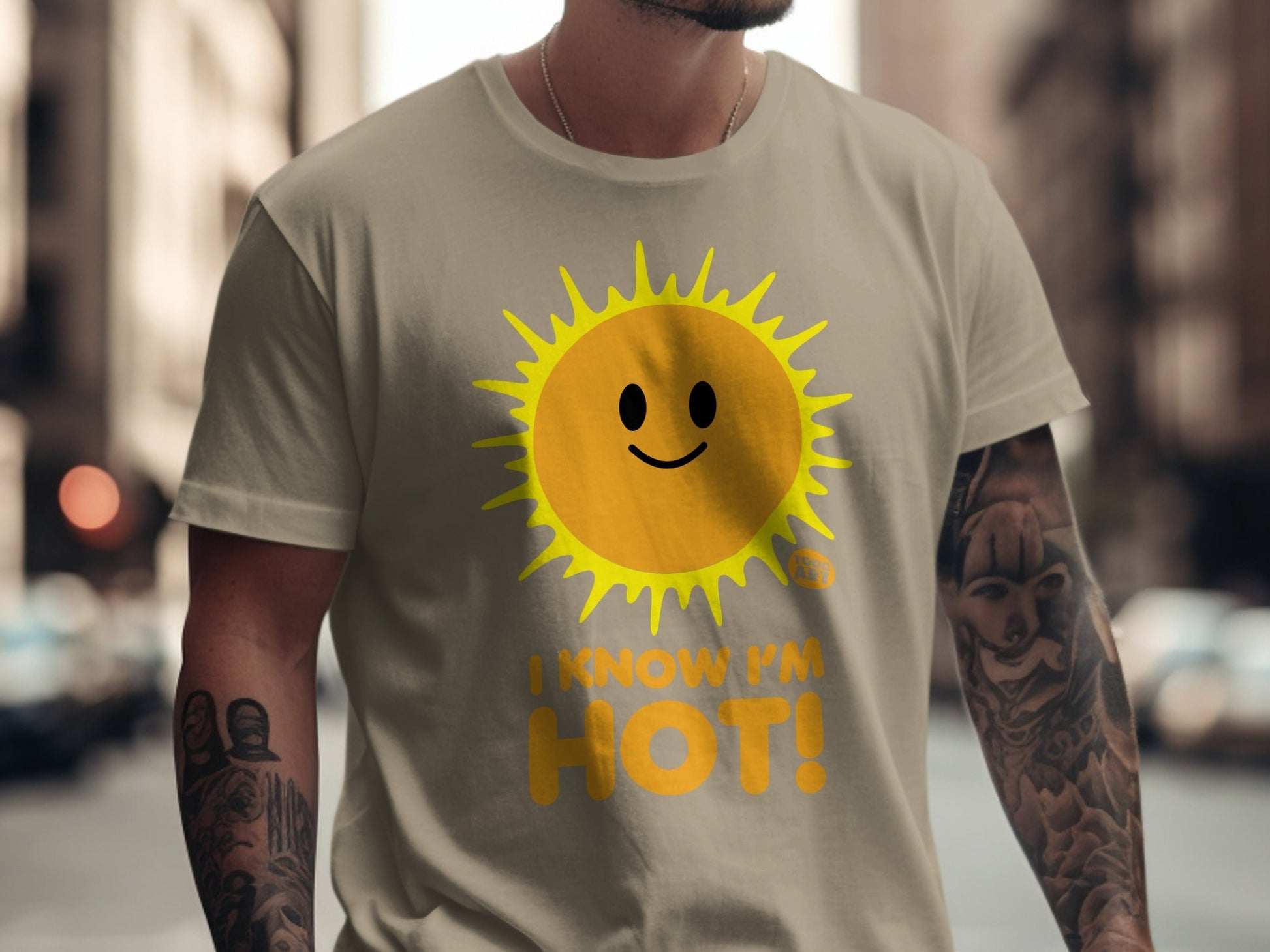 Tan t-shirt with a smiling sun graphic and text "I KNOW I'M HOT!".