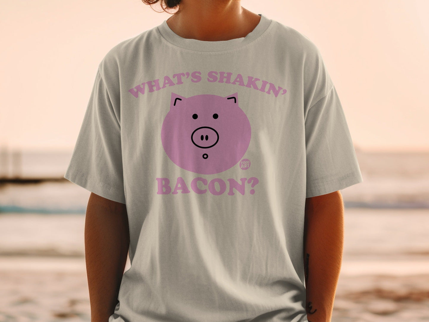 Light gray t-shirt with a pink pig and text "What's Shakin' Bacon?".