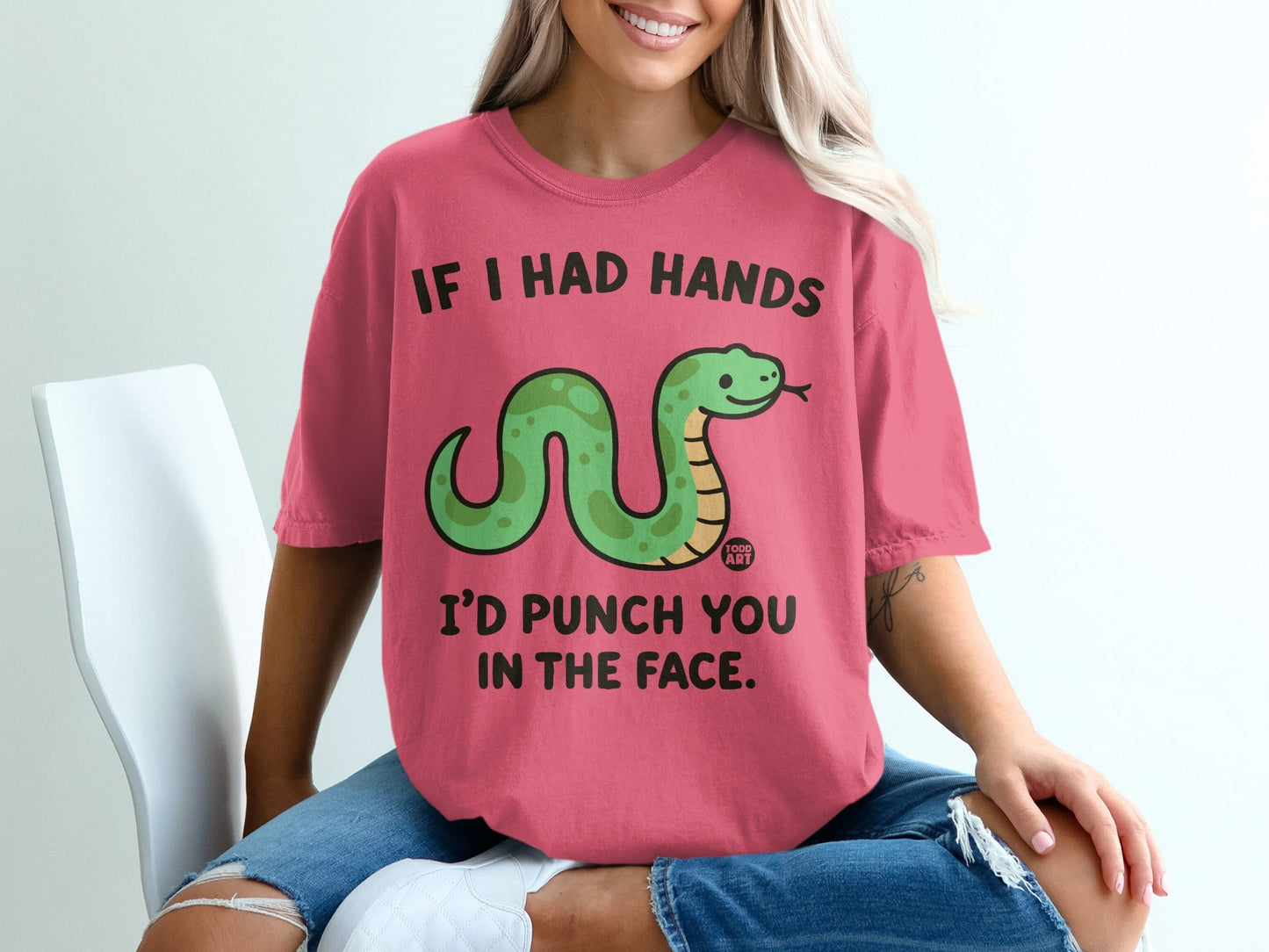 Pink t-shirt with green snake and text "IF I HAD HANDS I'D PUNCH YOU IN THE FACE".