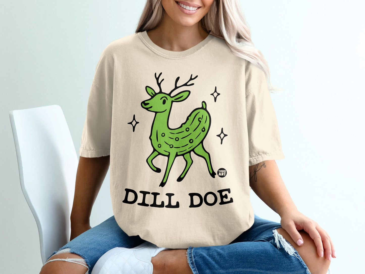 T-shirt with a green dill pickle deer graphic and "DILL DOE" text.
