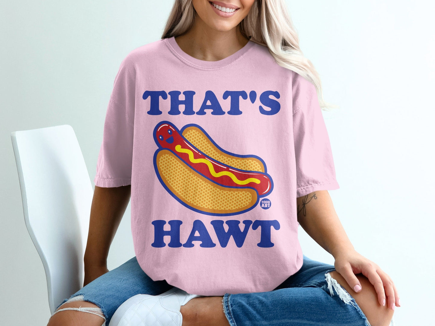 Pink t-shirt with "THAT'S HAWT" and a cartoon hot dog graphic.