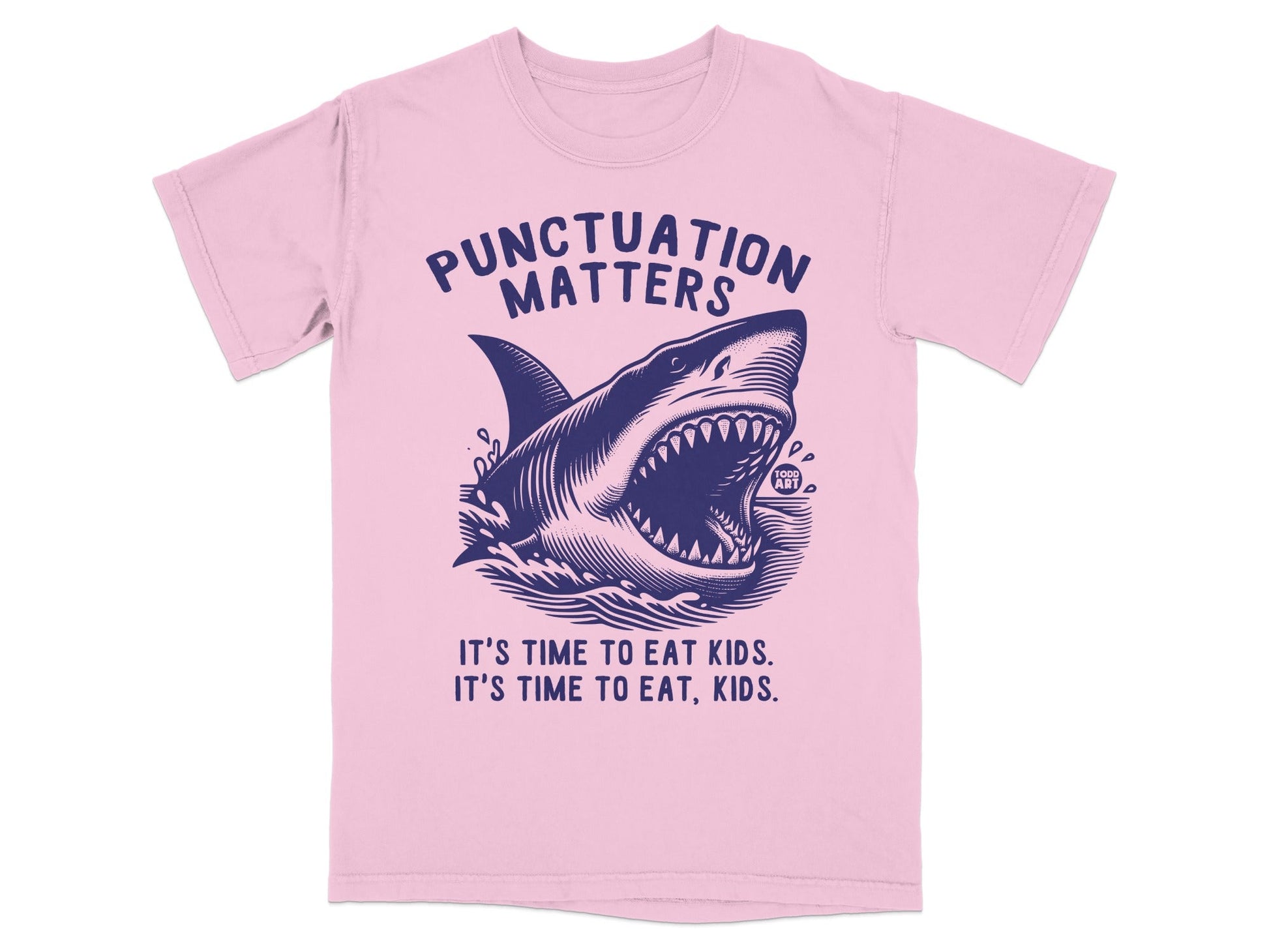 Pink t-shirt with a dark blue graphic of a shark and text reading "Punctuation Matters."